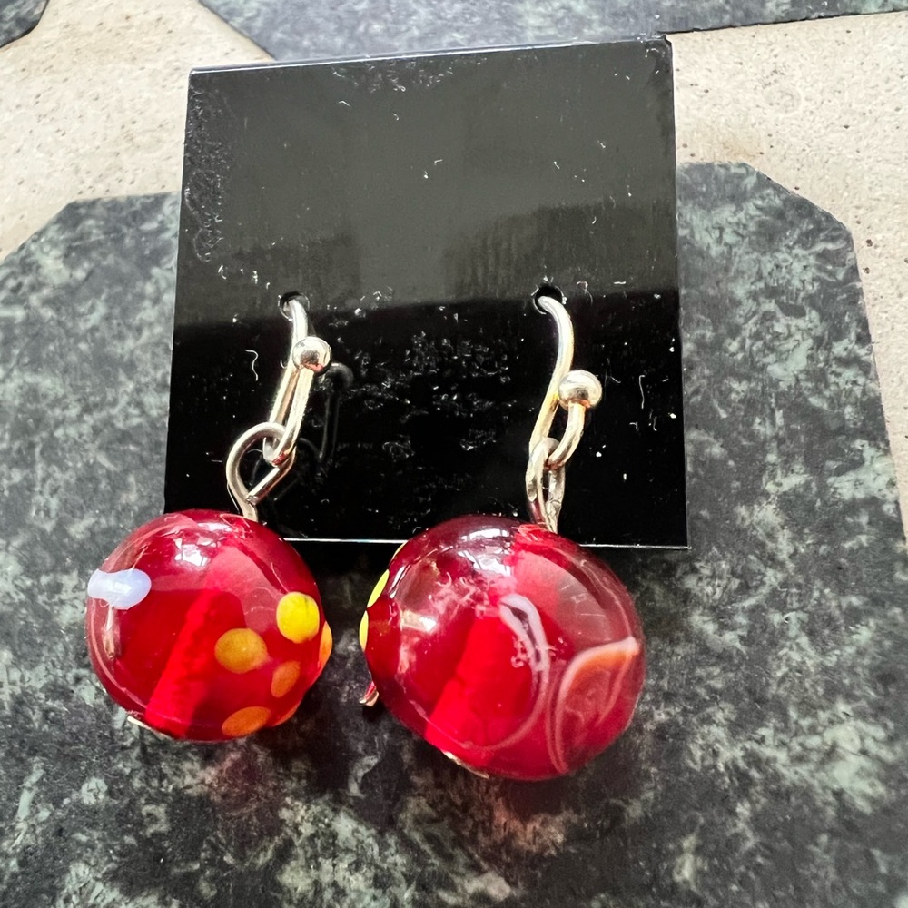 Art glass with abstract design balls on silver tone wires. Have some texture.